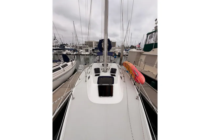 Slide: The Image of 1996 Catalina 36 MkII sailboat docked in a marina, overcast sky. - 17