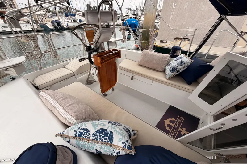 Slide: The Image of Cozy cockpit of a 1996 Catalina 36 MkII sailboat with cushions and pillows. - 21