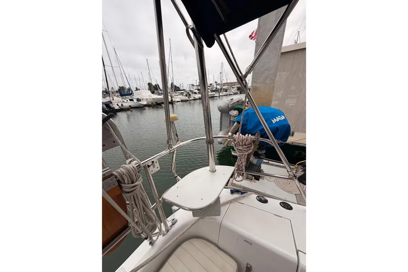 Slide: The Image of Cockpit view of a 1996 Catalina 36 MkII sailboat docked in a marina. - 25