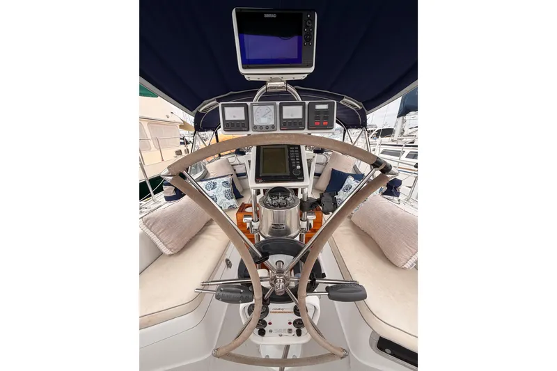 Slide: The Image of Cockpit of 1996 Catalina 36 MkII sailboat with navigation instruments and steering wheel. - 28