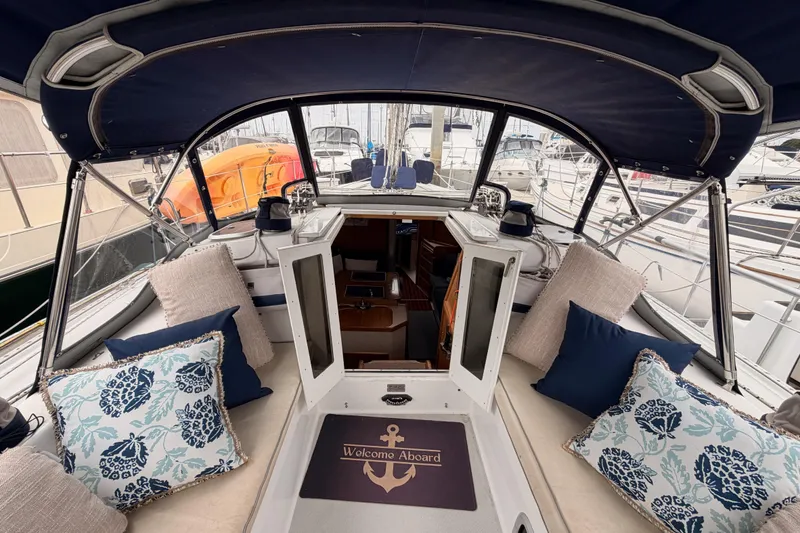 Slide: The Image of Cockpit of 1996 Catalina 36 MkII sailboat with cushions and "Welcome Aboard" mat. - 30