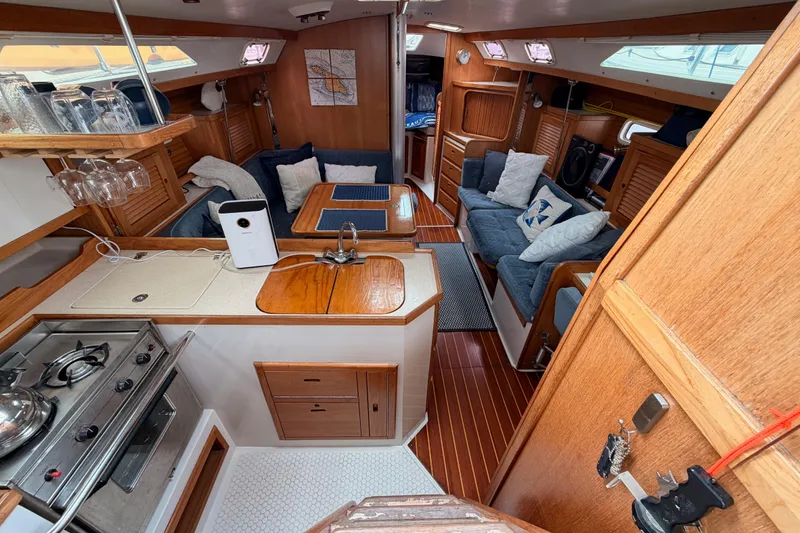 Slide: The Image of Interior of a 1996 Catalina 36 MkII sailboat with cozy seating and wooden finishes. - 32