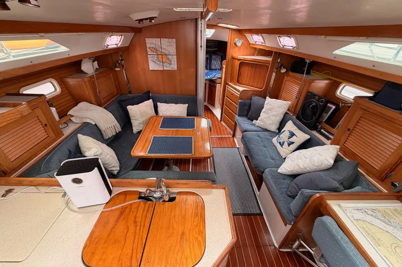 Slide: The Image of Interior of a 1996 Catalina 36 MkII sailboat with cozy seating and wooden finishes. - 34