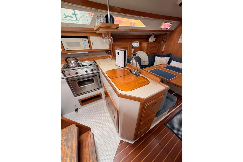 Slide: The Image of Interior of 1996 Catalina 36 MkII sailboat with kitchen and seating area. - 36