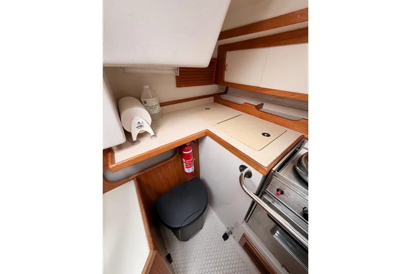 Slide: The Image of Compact galley kitchen in 1996 Catalina 36 MkII sailboat with stove, counter, and storage. - 39