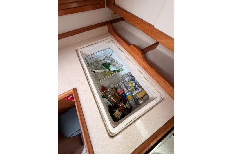 Slide: The Image of Built-in cooler with drinks inside a 1996 Catalina 36 MkII sailboat galley. - 40