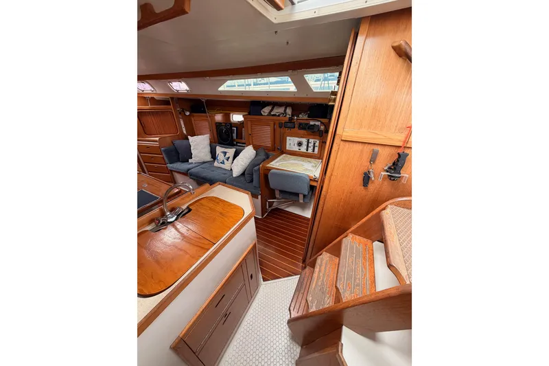 Slide: The Image of Interior of 1996 Catalina 36 MkII sailboat with cozy seating and wooden finishes. - 43