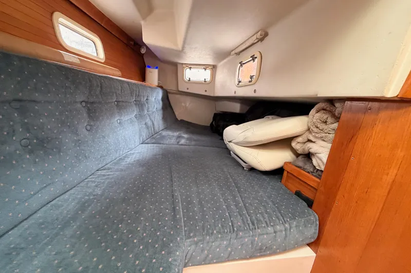 Slide: The Image of Cozy cabin interior of 1996 Catalina 36 MkII sailboat with blue cushions. - 46
