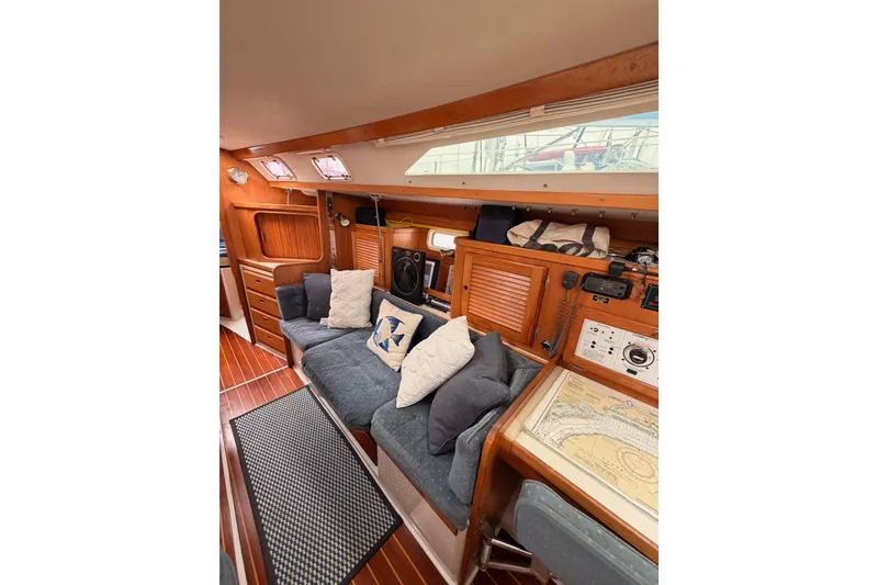 Slide: The Image of Interior of 1996 Catalina 36 MkII sailboat with cozy seating and navigation area. - 49