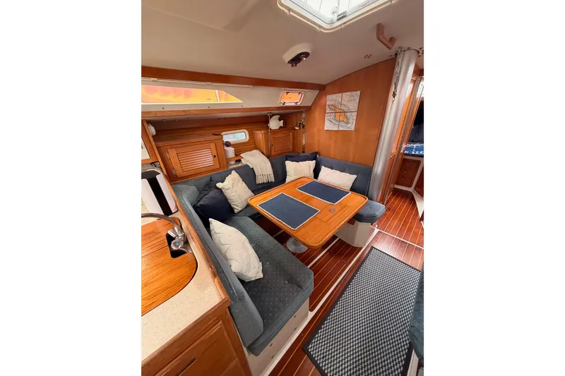 Slide: The Image of Interior of 1996 Catalina 36 MkII sailboat with cozy seating and wooden finishes. - 50