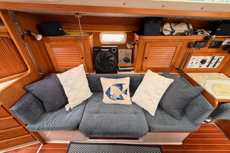 Slide: The Image of Interior of 1996 Catalina 36 MkII sailboat with cozy seating and nautical decor. - 52