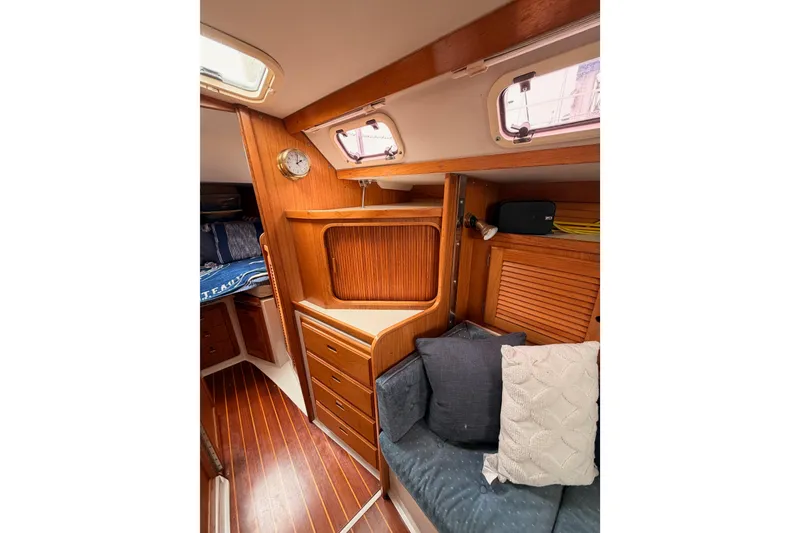 Slide: The Image of Interior of 1996 Catalina 36 MkII sailboat with wooden cabinetry and cozy seating area. - 53