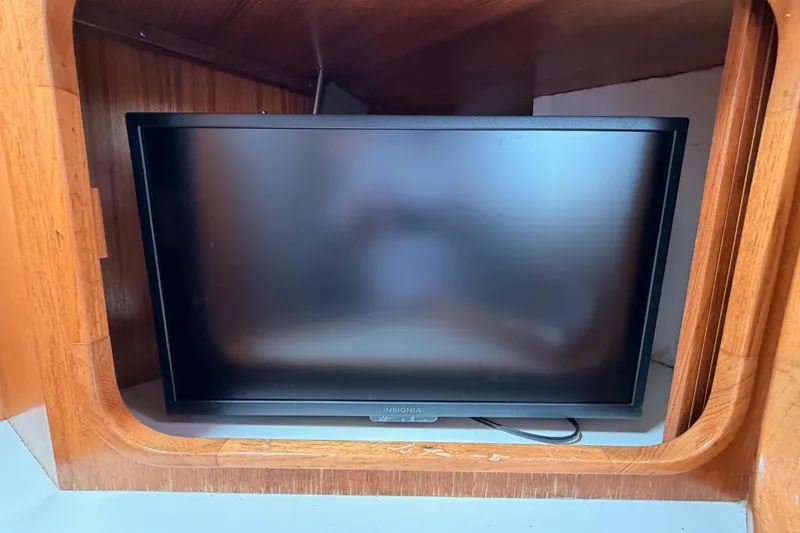 Slide: The Image of Flat-screen TV inside a wooden cabinet on a 1996 Catalina 36 MkII yacht. - 54