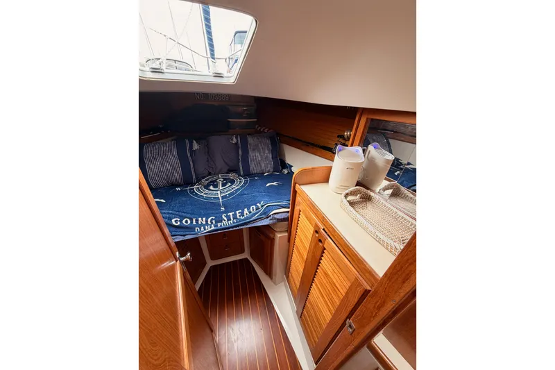Slide: The Image of Cozy cabin interior of 1996 Catalina 36 MkII sailboat with nautical bedding. - 58