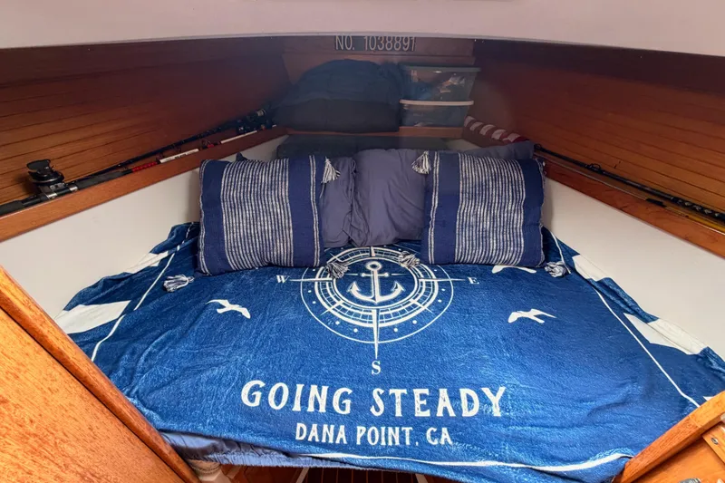 Slide: The Image of Cozy cabin interior of 1996 Catalina 36 MkII sailboat with nautical-themed bedding. - 59