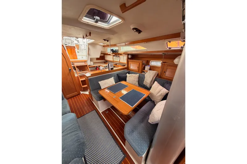 Slide: The Image of Interior of 1996 Catalina 36 MkII sailboat with cozy seating and wooden finishes. - 63