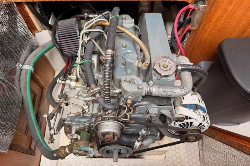 Slide: The Image of Engine compartment of a 1996 Catalina 36 MkII sailboat, showcasing mechanical components. - 69
