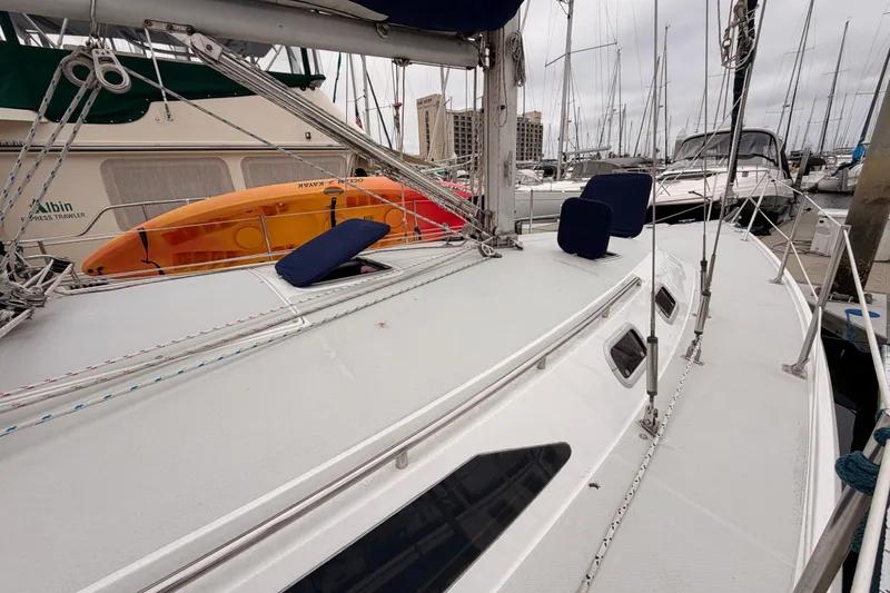 Slide: The Image of 1996 Catalina 36 MkII sailboat docked, featuring deck and rigging details. - 7