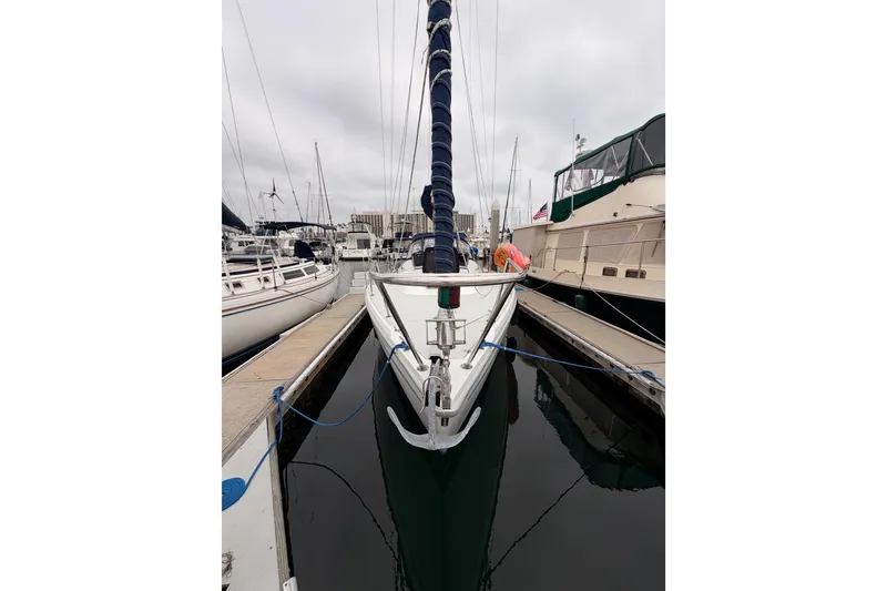Slide: The Image of 1996 Catalina 36 MkII sailboat docked in a marina, overcast sky. - 8