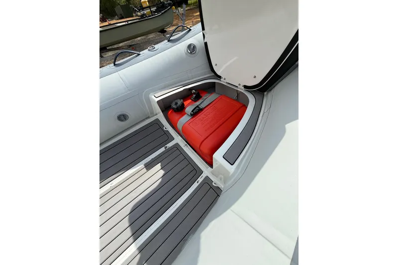 Slide: The Image of 2026 Highfield Classic 360 FCT boat storage compartment with red fuel tank. - 4