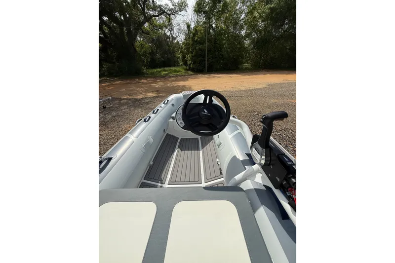 Slide: The Image of 2026 Highfield Classic 360 FCT boat interior with steering wheel and controls. - 6