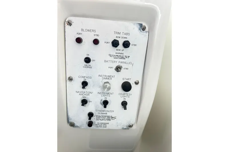 Slide: The Image of Control panel of a 1996 Hatteras 39 Sport Express boat with various switches and indicators. - 22