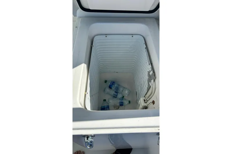 Slide: The Image of Cooler with water bottles on 1996 Hatteras 39 Sport Express boat. - 38