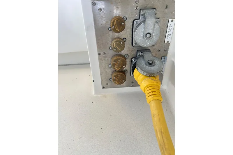 Slide: The Image of Electrical panel with yellow power cord on 1996 Hatteras 39 Sport Express boat. - 43