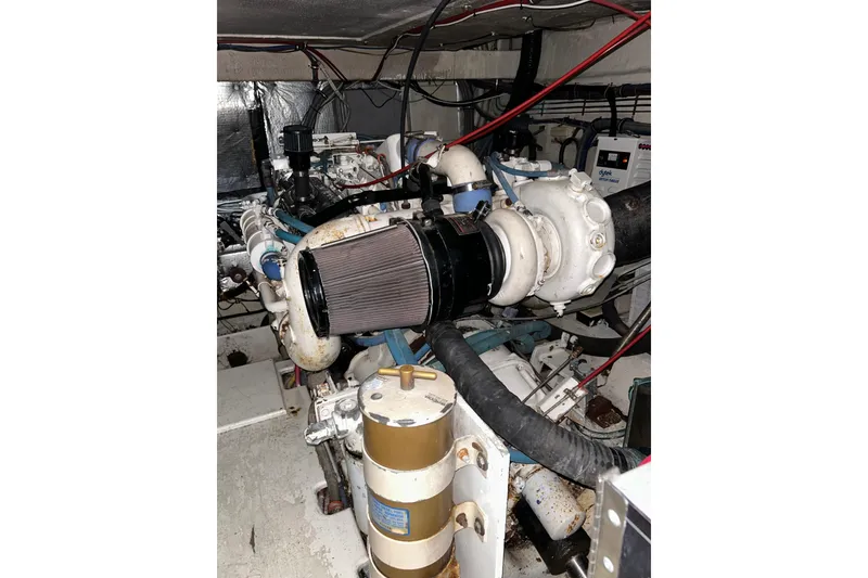 Slide: The Image of Engine room of 1996 Hatteras 39 Sport Express with visible components and wiring. - 52