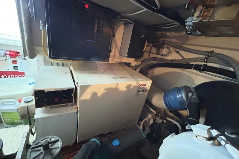 Slide: The Image of Engine room of 1996 Hatteras 39 Sport Express with Onan Marine GenSet. - 53