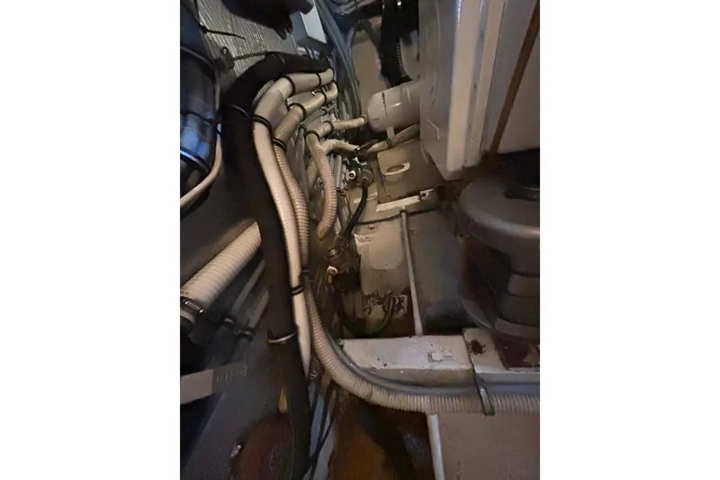 Slide: The Image of Engine room of 1996 Hatteras 39 Sport Express with visible wiring and components. - 60
