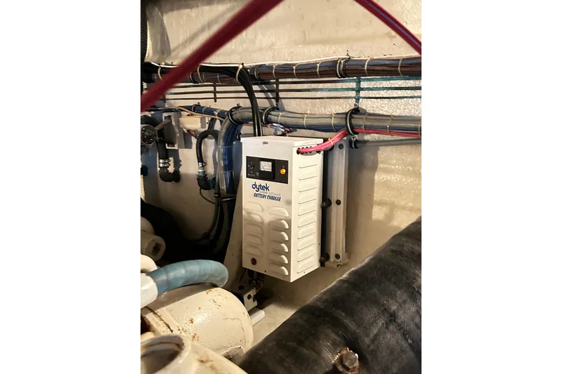 Slide: The Image of Battery charger in 1996 Hatteras 39 Sport Express engine room, with wiring and components. - 63