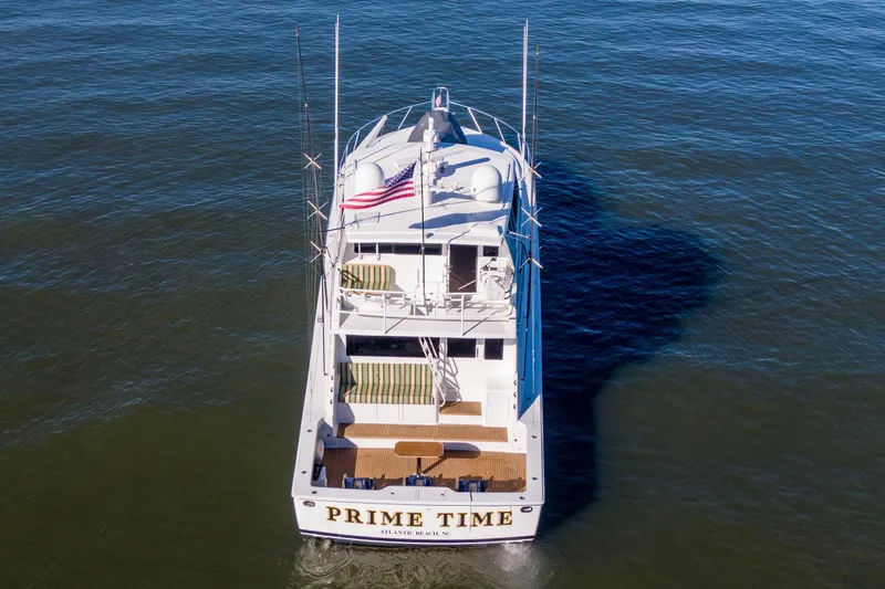 Slide: The Image of Aerial view of 2002 Viking 65 Enclosed Bridge yacht on open water. - 13