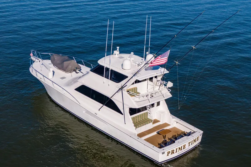 Slide: The Image of 2002 Viking 65 Enclosed Bridge yacht on open water, aerial view. - 14