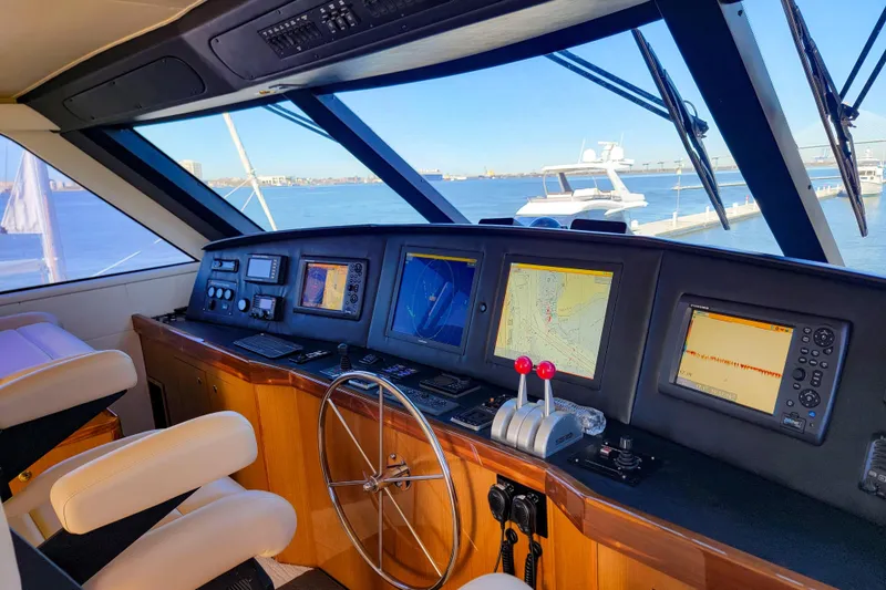 Slide: The Image of Interior view of 2002 Viking 65 Enclosed Bridge yacht cockpit with navigation screens. - 36