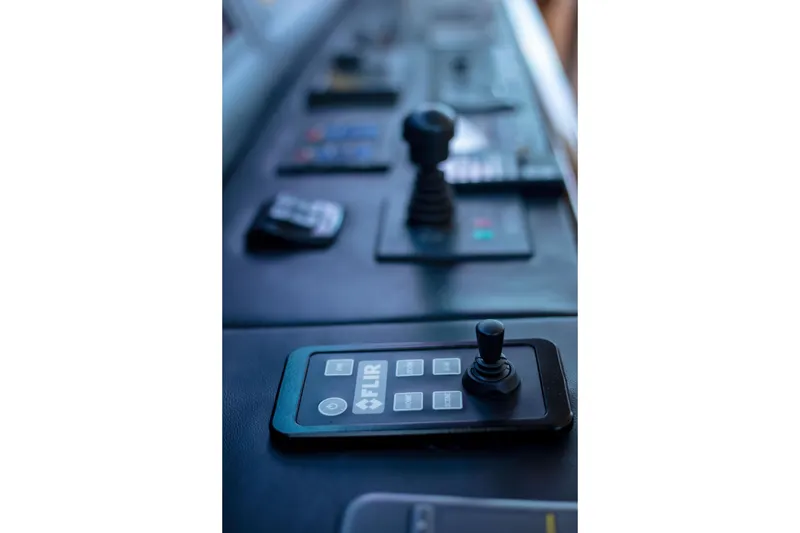 Slide: The Image of Control panel of 2002 Viking 65 Enclosed Bridge yacht with joystick and FLIR system. - 41