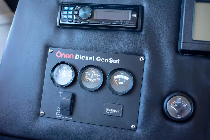 Slide: The Image of Control panel of Onan Diesel GenSet on 2002 Viking 65 Enclosed Bridge yacht. - 43