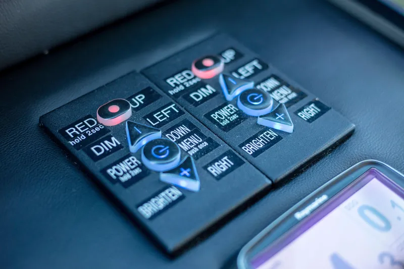 Slide: The Image of Control panel on 2002 Viking 65 Enclosed Bridge yacht, featuring various adjustment buttons. - 46