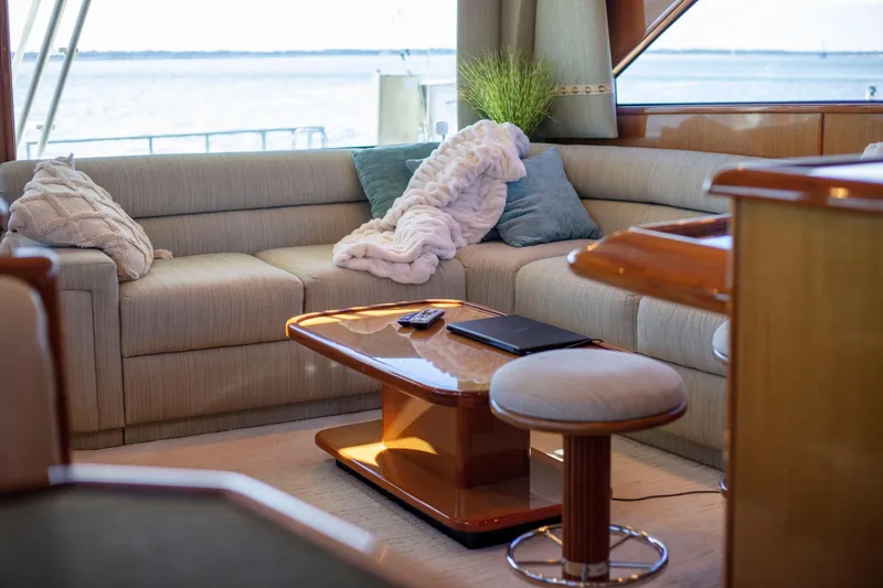 Slide: The Image of Luxurious interior of 2002 Viking 65 Enclosed Bridge yacht with cozy seating and ocean view. - 55