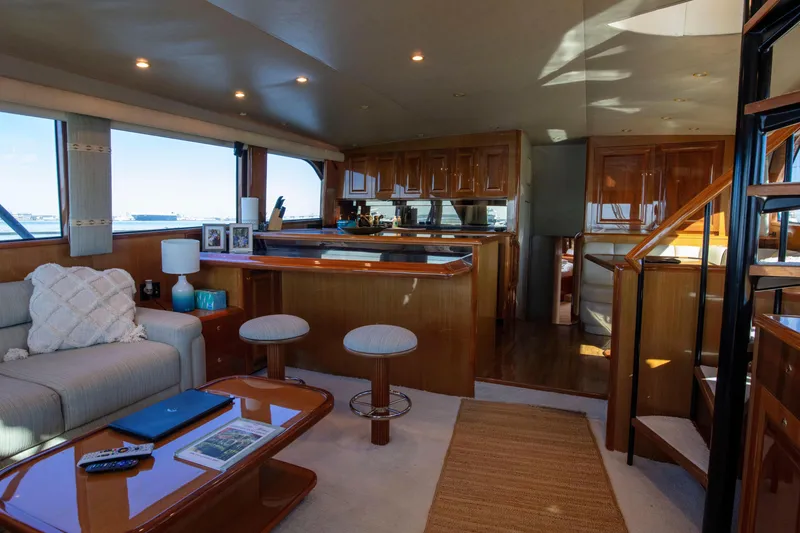 Slide: The Image of Luxurious interior of 2002 Viking 65 Enclosed Bridge yacht with elegant wood finishes. - 56