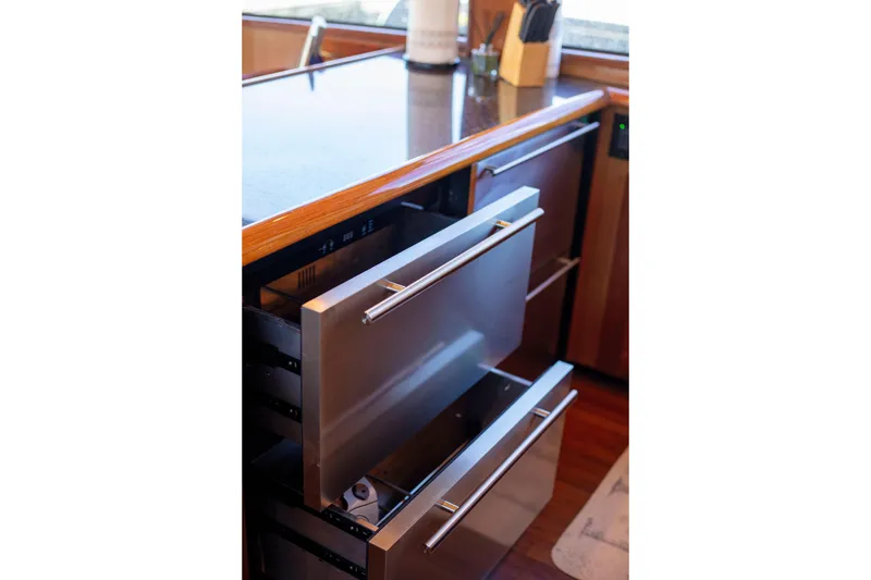 Slide: The Image of Stainless steel drawers in 2002 Viking 65 Enclosed Bridge yacht kitchen. - 62