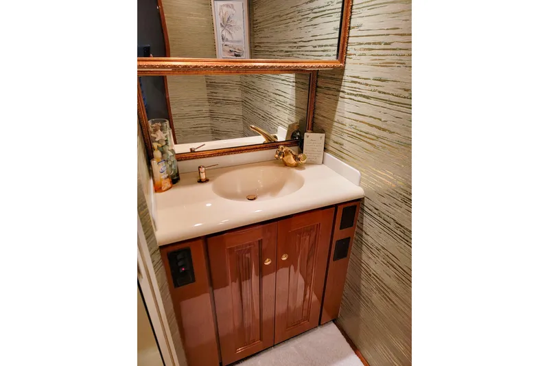 Slide: The Image of Luxurious bathroom vanity on 2002 Viking 65 Enclosed Bridge yacht. - 77