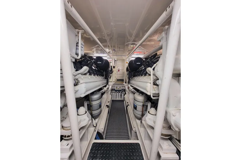 Slide: The Image of Engine room of 2002 Viking 65 Enclosed Bridge yacht, showcasing dual engines. - 84