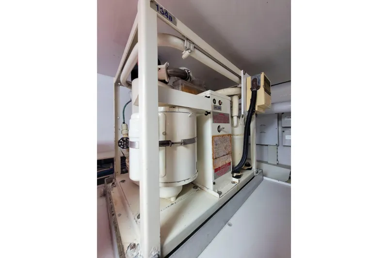 Slide: The Image of Engine room equipment on a 2002 Viking 65 Enclosed Bridge yacht. - 93