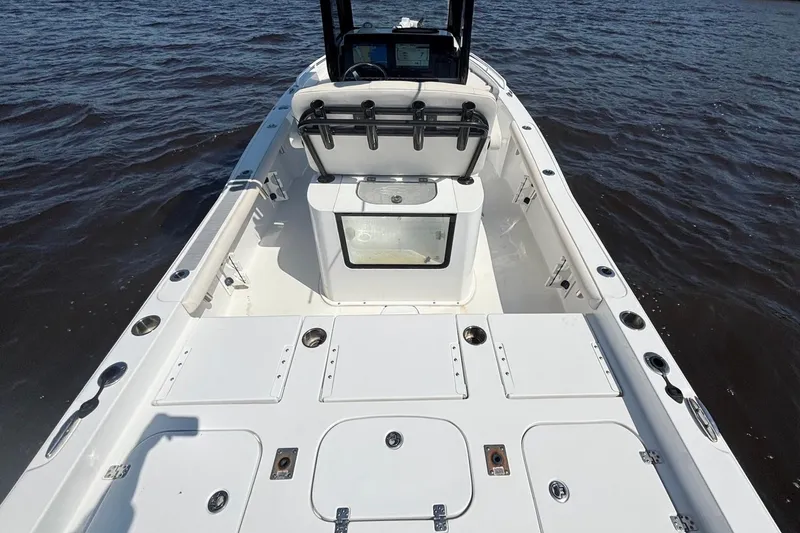 Slide: The Image of 2023 Sea Hunt BX 25 FS boat interior with spacious deck and storage compartments. - 15