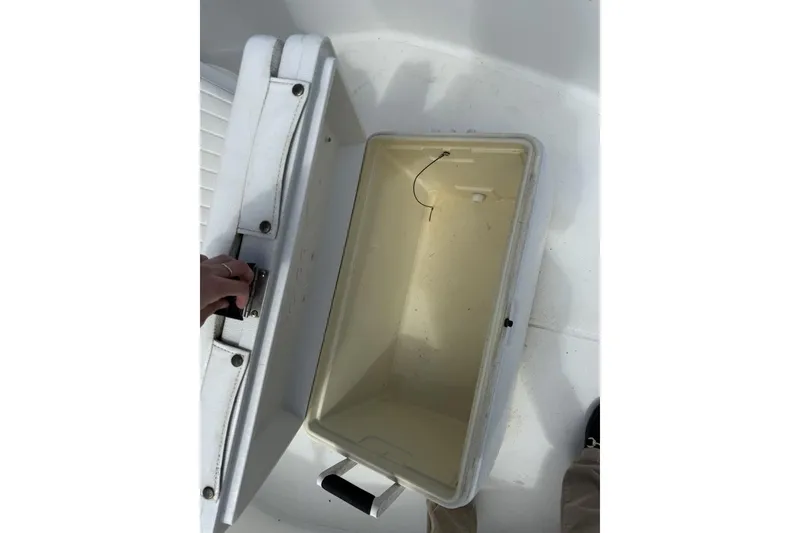 Slide: The Image of Open storage compartment on a 2016 Boston Whaler 170 Montauk boat. - 16