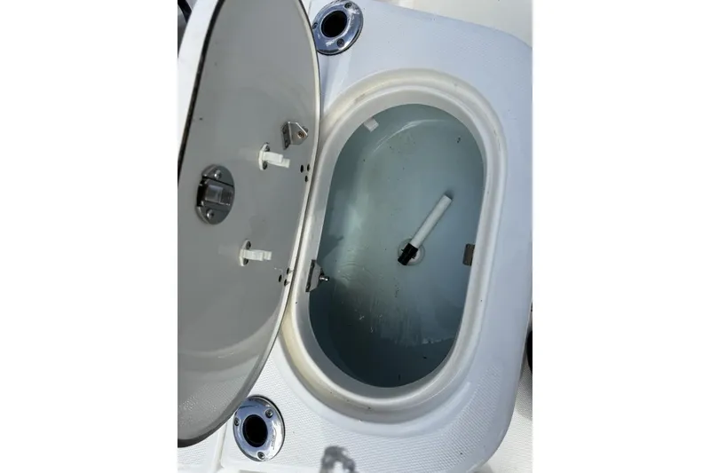 Slide: The Image of Open storage compartment on a 2016 Boston Whaler 170 Montauk boat. - 17