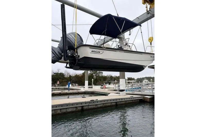 Slide: The Image of 2016 Boston Whaler 170 Montauk boat suspended at marina dockside. - 5