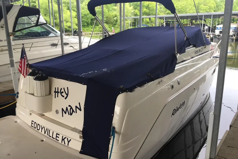 Slide: The Image of 2003 Rinker Fiesta Vee 270 boat docked with blue cover, Eddyville KY. - 2
