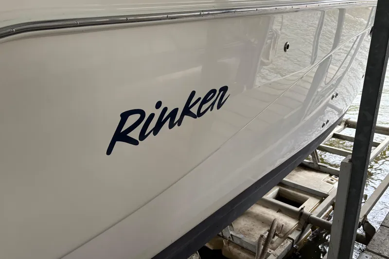 Slide: The Image of 2003 Rinker Fiesta Vee 270 boat on a lift, side view. - 7